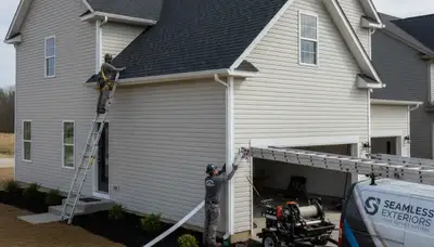 Seamless gutter installation on vinyl siding home in Greenville, NC by Next Level Exteriors